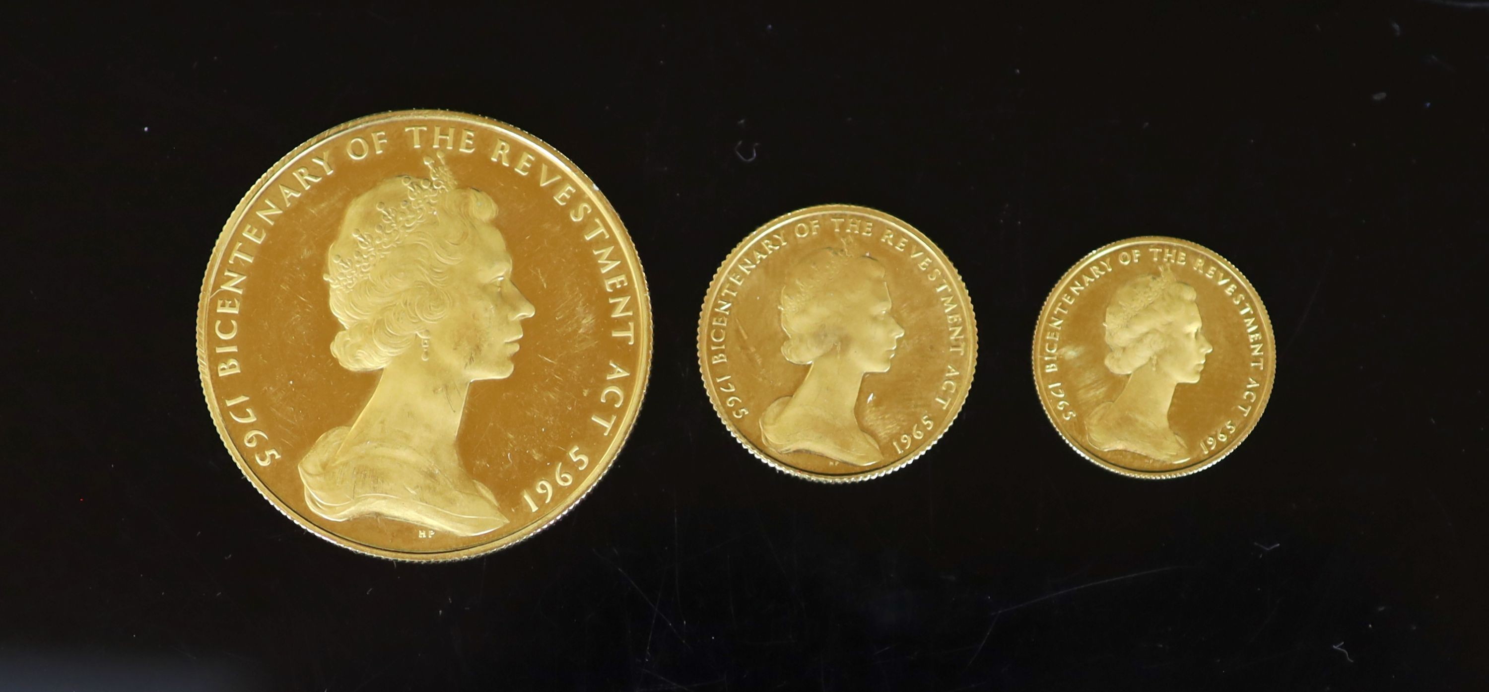 An Isle of Man Bi-Centenary set of three coins, 1965, five pounds, sovereign and half sovereign, cabinet wear otherwise Brilliant UNC